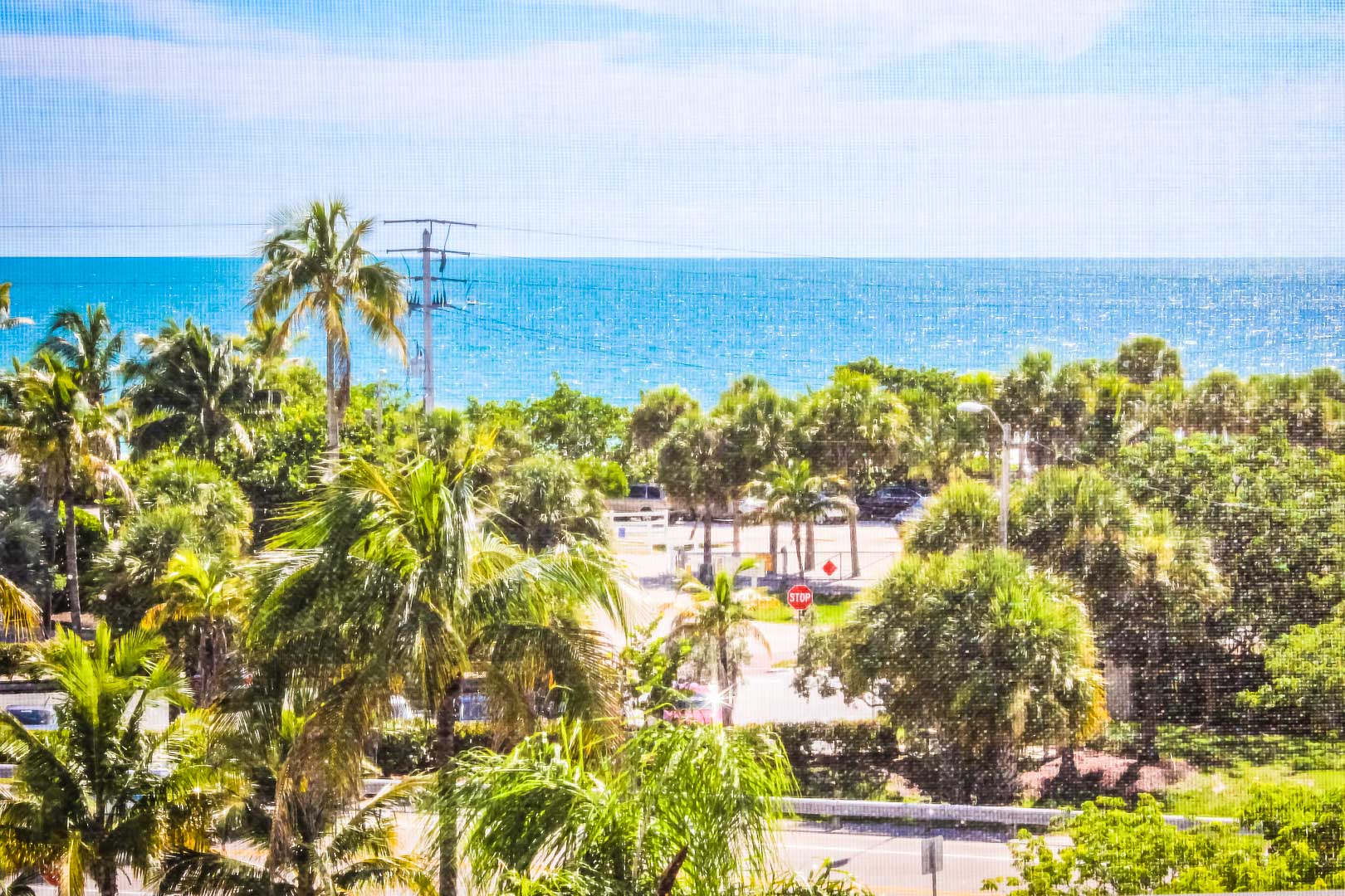 A nature filled view to the beach at VRI's Bonita Resort and Club in Florida.